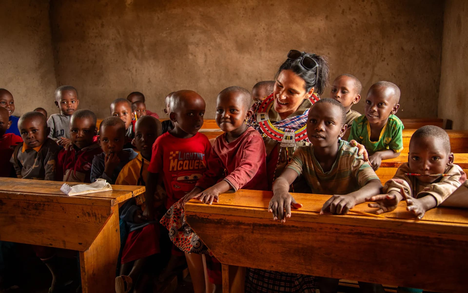 EXG guests visiting a Maasai community classroom