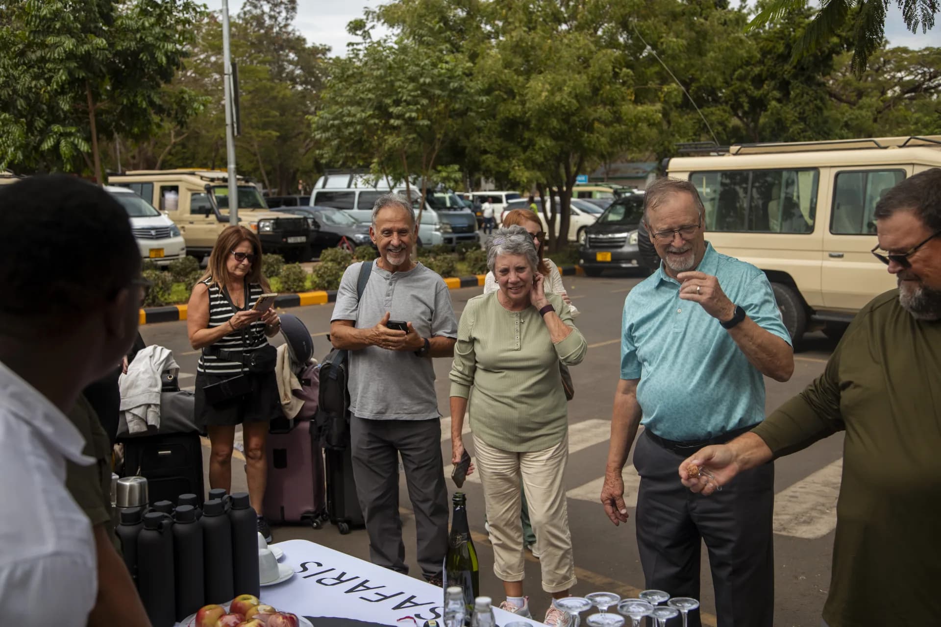 Guests welcomed with drinks at an arrival table on safari