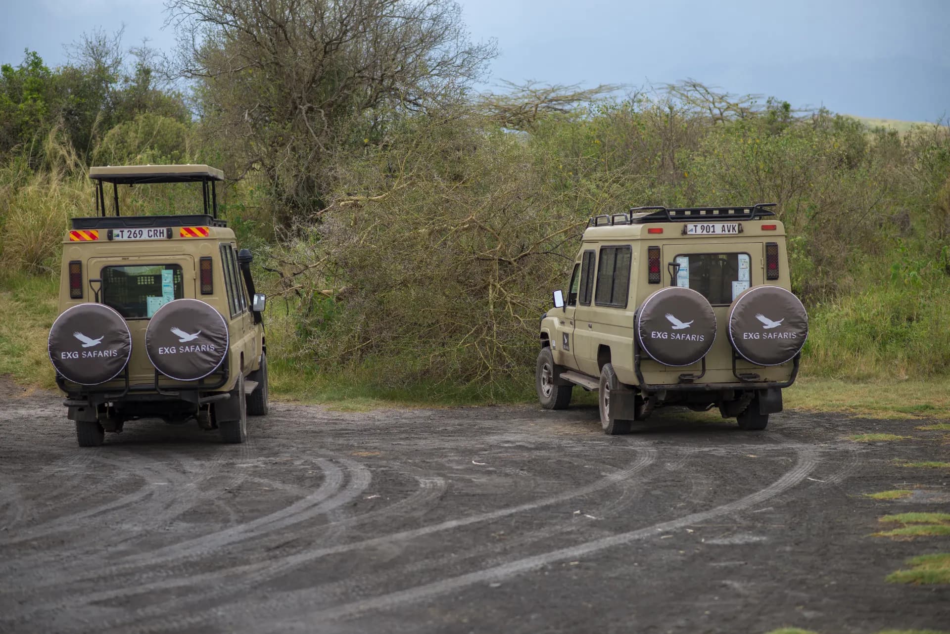 Two EXG Safaris Land Cruisers on a bush track